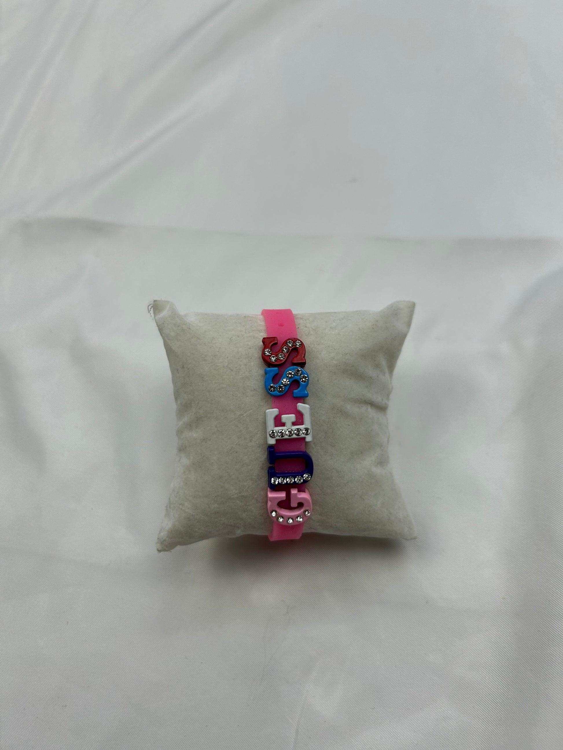 Flashy pink spell out logo pvc bracelet