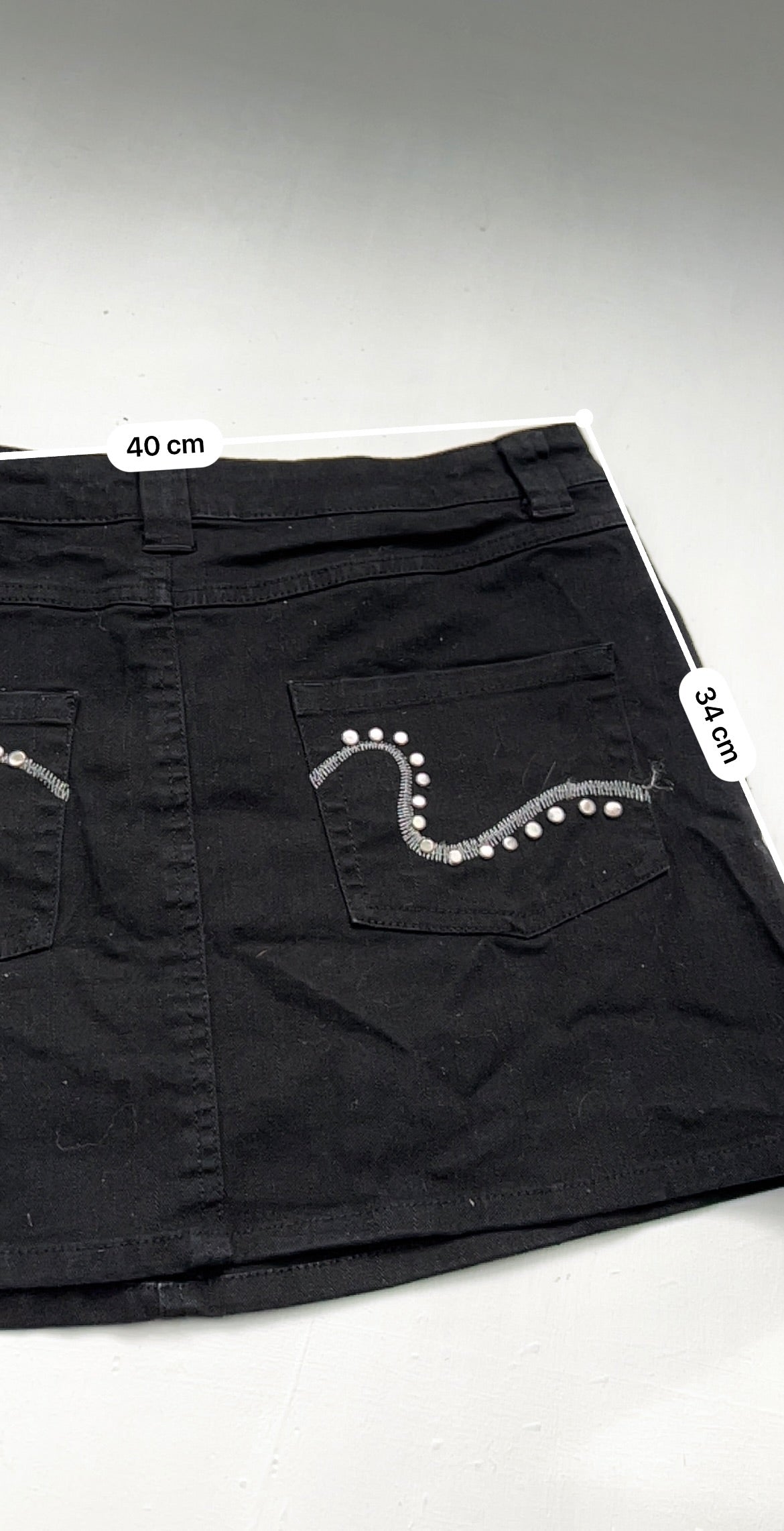 Black denim low rise mini skirt (M)