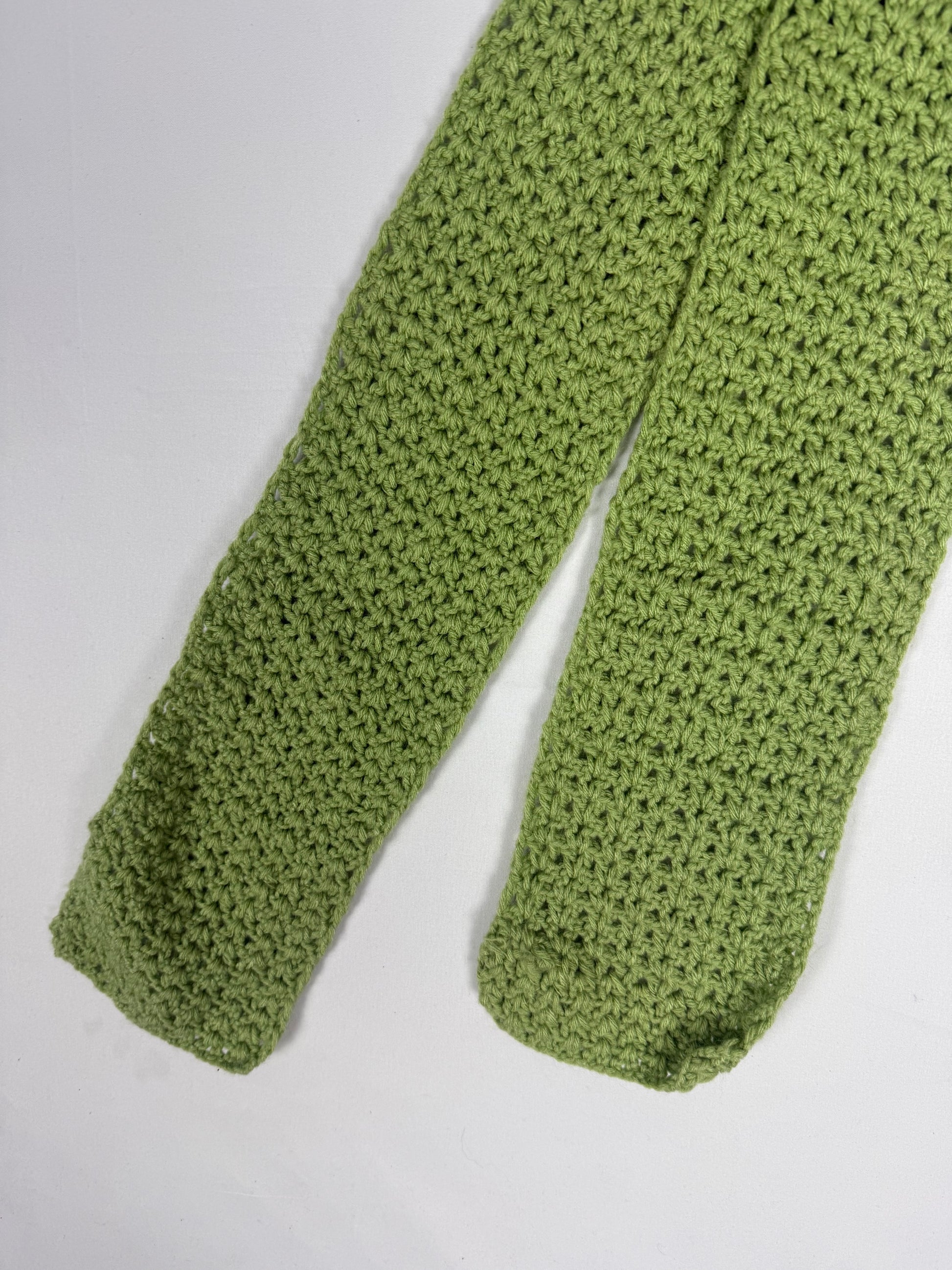 Green knitted winter scarf